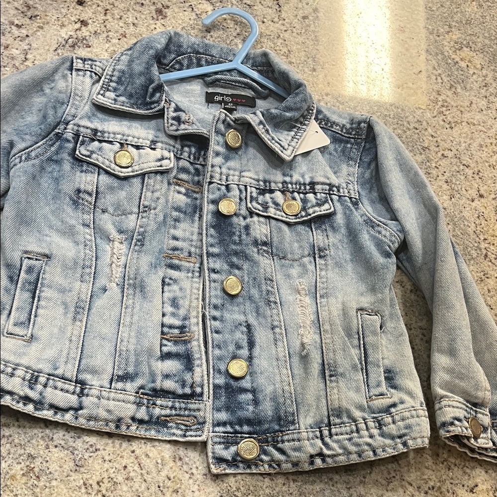 Trendy Light Blue Jean Jacket with Gold Accents and Cool Vibe logo on the back.